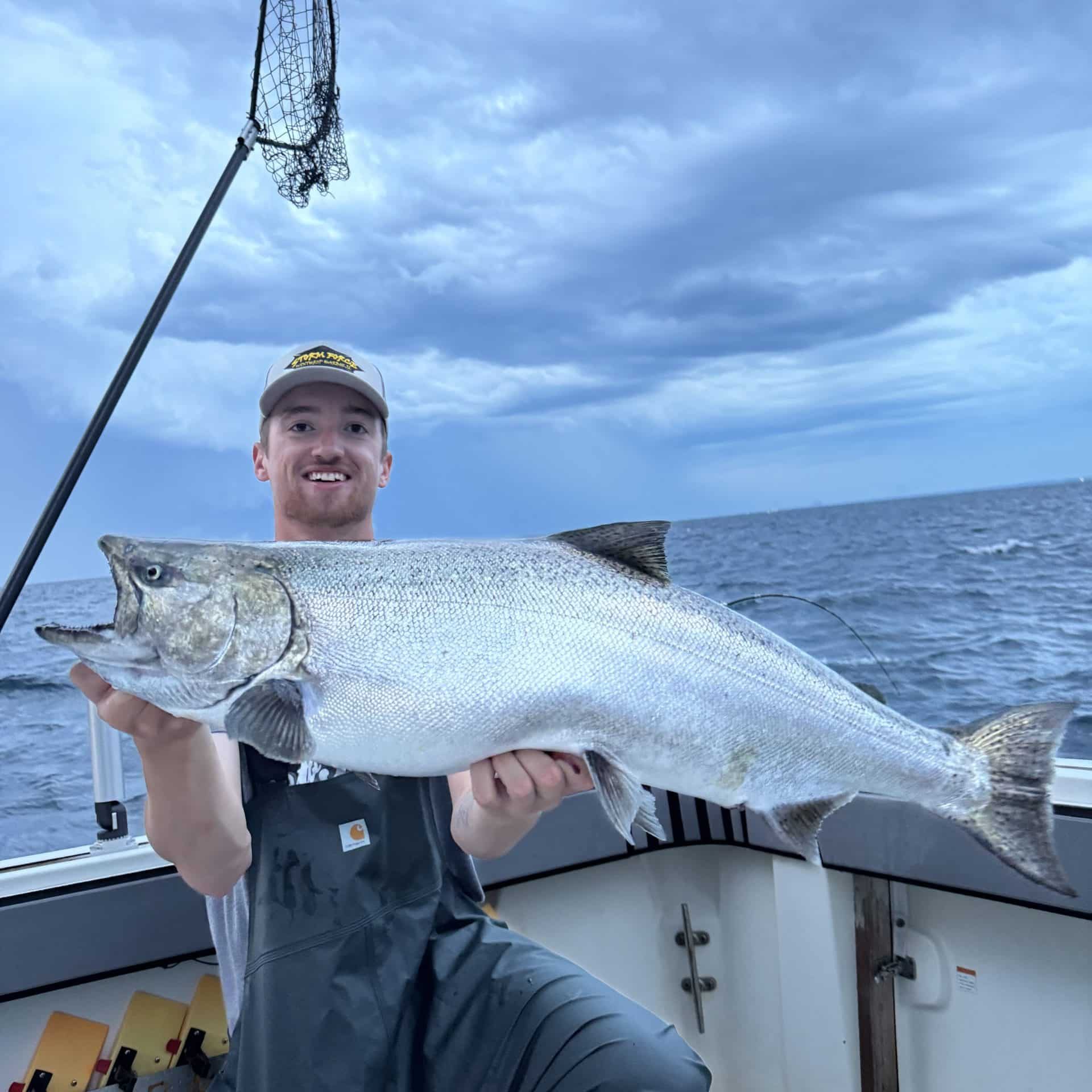 Captain Blake with a monster fish on Storm Force fishing charter on Lake Michigan